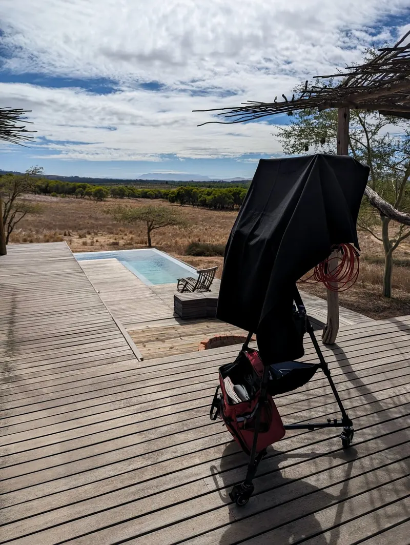 A camera workstation on a deck beside a pool